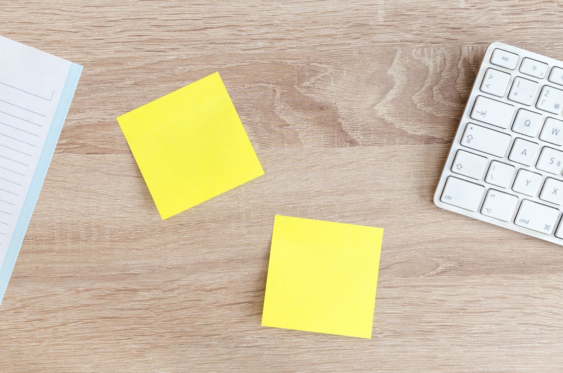 Yellow Post it notes on the desk.