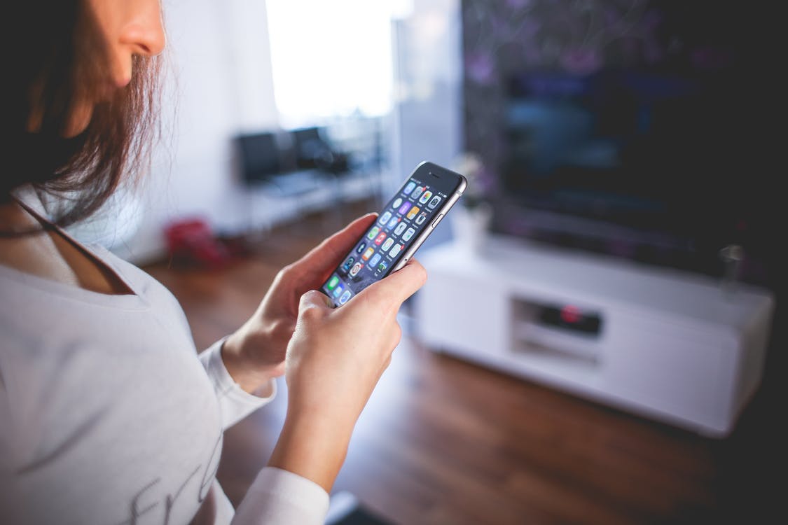 Woman using iPhone.